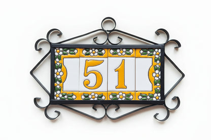 Decorative house number sign with '51' on a white background