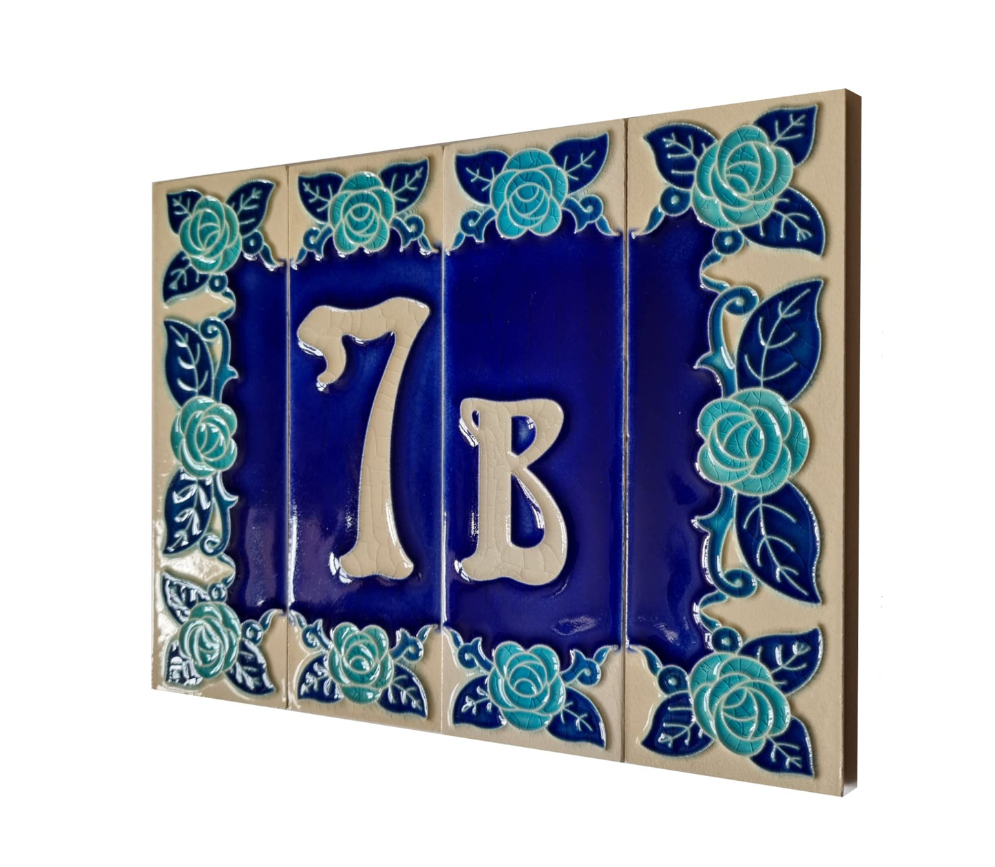 Ceramic house number tile with '7B' and decorative blue roses on a white background